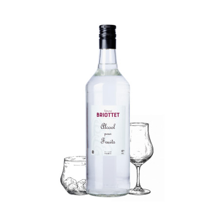 Bottle of fruit liqueur  Maison Briottet, 40% ABV, 70cl, with two cocktail glasses and ice cubes