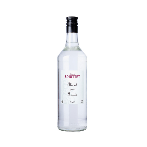 Bottle of fruit liqueur  Maison Briottet, 40% ABV, 70cl, with two cocktail glasses and ice cubes