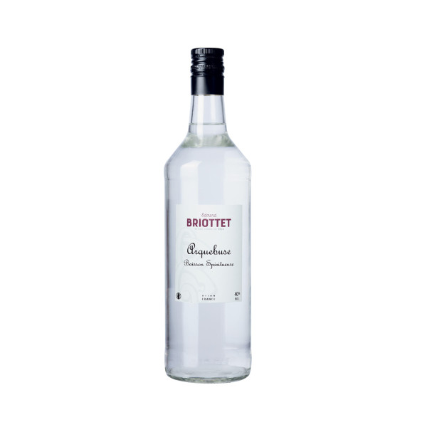 Bottle of Arquebuse Maison Briottet, 40% alcohol by volume, 1 litre, with two cocktail glasses and ice cubes